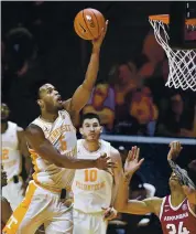  ?? SAUL YOUNG — VIA AP POOL ?? Tennessee’s Josiah-Jordan James, who finished with 17 points Wednesday, puts up a shot against Arkansas.