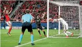  ?? PHOTO: REUTERS ?? Benfica goalkeeper Mile Svilar carries the ball over the line to hand Manchester United the 1-0 win.