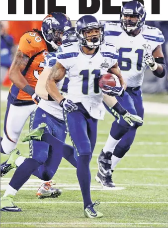  ?? Paul J. Bereswill ?? HE’S GONE! Percy Harvin takes returns the opening kick in the second half for a touchdown in the Seahawks’ 43-8 blowout win over the Broncos in the Super Bowl.