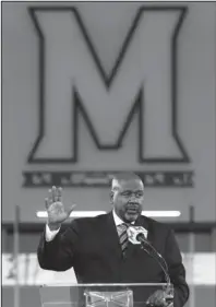  ?? The Associated Press ?? BACK HOME: Maryland’s new head football coach Mike Locksley speaks Thursday at a new conference in College Park, Md.