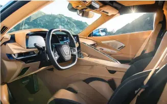  ??  ?? Below: Steering wheel and instrument panel sit lower than before thanks to the engine moving behind the seats; quartic wheel may divide opinion