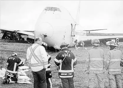  ?? ANDREW VAUGHAN
THE CANADIAN PRESS ?? A SkyLease Cargo plane skidded off Runway 14 just after 5 a.m. It wasn’t clear what caused the accident that left two engines sheared off.