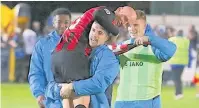  ?? Peter Hilton Photograph­y ?? Danny Whitaker is carried from the field after the game at Guiseley