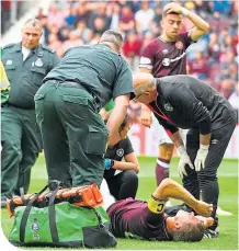  ??  ?? Christophe Berra writhes in agony back in August