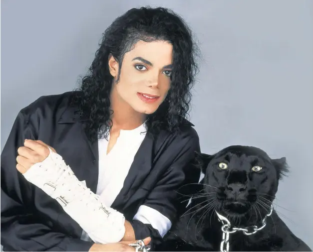  ??  ?? BLACK LIKE ME Michael Jackson and the black panther used in the video of his song ‘Black or White’. The violent ‘panther dance’ caused an uproar but should be seen not as a publicity stunt but as a cry of black outrage.