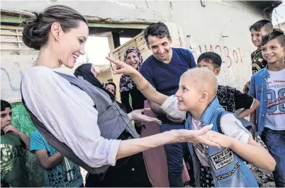  ?? PHOTO: REUTERS ?? A light moment . . . UNHCR special envoy Angelina Jolie meets Falak (8) during a visit to West Mosul, in Iraq, on Saturday.