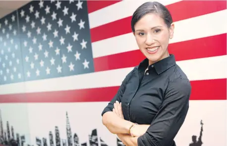  ??  ?? Captain Jessica Tait poses for a picture at the US embassy in Bangkok after she and her Special Ops colleagues played a part in the Tham Luang cave rescue mission in Chiang Rai earlier this month.