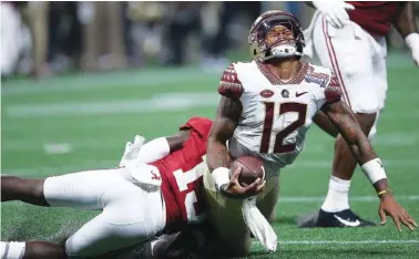  ?? ASSOCIATED PRESS FILE PHOTO ?? Alabama defensive back Ronnie Harrison (15) hits Florida State quarterbac­k Deondre Francois (12) during Saturday’s game in Atlanta. Alabama won 24-7, and Francois sustained a season-ending injury.