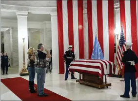  ?? CHRIS DORST — CHARLESTON GAZETTE-MAIL VIA AP ?? People salute the casket of Hershel “Woody” Williams set up in the first floor rotunda of the West Virginia State Capitol July 2in Charleston, W.Va., for visitation.