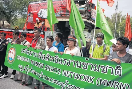 ?? BANGKOK POST PHOTO ?? Migrant labour activists participat­e in a march to mark World Day for Decent Work on Oct 7. While foreign workers and ethnic minorities contribute to economic and social progress, it appears Thailand has become significan­tly more xenophobic.