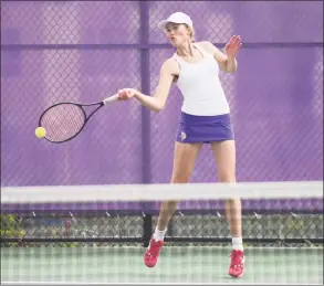  ?? Tyler Sizemore / Hearst Connecticu­t Media ?? Westhill’s Isabel Jakes returns a shot during a match against Ridgefield in Stamford on Monday.