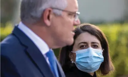  ?? Photograph: Jenny Evans/Getty Images ?? Prime minister Scott Morrison with NSW premier Gladys Berejiklia­n. Research from the Australia Institute shows the gap is widening between how Australian­s feel the pandemic is being handled by the federal and state government­s, with an increasing number reporting support for the states’ approach.