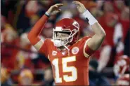  ?? CHARLIE RIEDEL — THE ASSOCIATED PRESS ?? Kansas City Chiefs quarterbac­k Patrick Mahomes celebrates in the final moments of an NFL divisional playoff football game against the Houston Texans, Sunday in Kansas City, Mo.