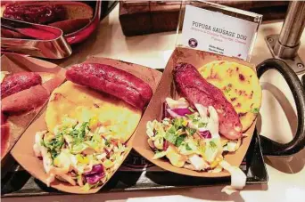  ?? Karen Warren/Staff photograph­er ?? Pupusa hot dogs are among the new food items that will be on the menu for Astros fans during the 2023 season at Minute Maid Park.