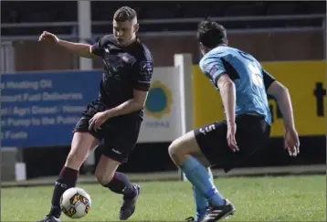  ??  ?? Wexford winger Mark Slater taking on Cobh Ramblers defender James McSweeney.