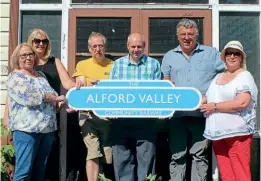  ?? ?? Members of the Alford Valley Community Railway celebrate the new 25-year lease on the line with Aberdeensh­ire Council. AVCR