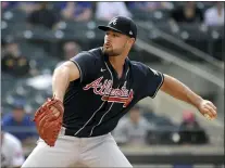  ?? BILL KOSTROUN — THE ASSOCIATED PRESS ?? Atlanta Braves pitcherKyl­e Muller delivers the ball to the New York Mets during the first inning of the first game of a baseball doublehead­er Monday, July 26, 2021, in New York.