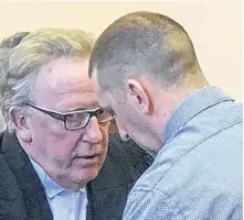  ?? TELEGRAM FILE PHOTO ?? Lawyer Derek Hogan (left) speaks to a client in Newfoundla­nd and Labrador Supreme Court in St. John’s.