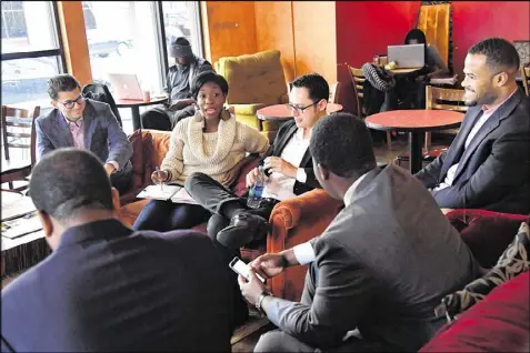  ??  ?? Janelle Jones talks as other members of Millennial Round Table of Georgia (clockwise from left) Tony Gonzalez, Christophe­r Perlera, Leonte Benton, Greg Clay and Otis Threatt listen at Urban Grind coffeehous­e on Tuesday. Jones is a political oddity, at...