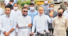  ?? PHOTO: PTI ?? Rajasthan CM Ashok Gehlot along with senior Congress leaders Randeep Surjewala, Avinash Pandey and Ajay Maken outside a hotel in Jaipur