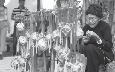  ?? ZHU XINGXIN / CHINA DAILY ?? Zhao Poying, 86, makes embroidery balls in Jiuzhou village of Jingxi, Guangxi Zhuang autonomous region, last month. Almost all of the 500 households in the village are engaged in the business.