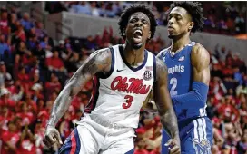  ?? THOMAS GRANING/ASSOCIATED PRESS ?? Mississipp­i center Nysier Brooks exults after a dunk against No. 18 Memphis in Oxford, Miss., on Saturday. Memphis lost its third straight.