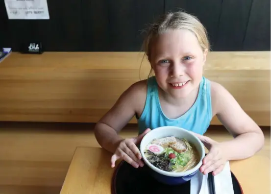  ?? VINCE TALOTTA/TORONTO STAR ?? Inspired by the David Chang season of Mind of a Chef on Netflix, Maike Nouwens, 9, began a quest to sample bowls of ramen across the city. She liked them all, but found her favourite.