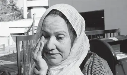  ?? BRIAN WITTE/ASSOCIATED PRESS PHOTOS ?? Shamim Rahman, the mother of Adnan Syed, wipes a tear away after attending arguments Thursday in the Court of Appeals over reinstatin­g Syed’s conviction in the murder in 1999 of his girlfriend, Hae Min Lee. “He’s hopeful,” she said, “He’s in good hands.”