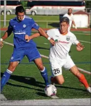  ??  ?? Kingston Stockade FC’s Juan Gatti duels for the ball during Monday’s game.