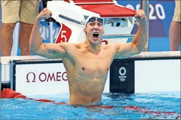  ?? Los Angeles Times/tns - Robert Gauthier ?? Chase Kalisz celebrates after winning the 400-meter individual medley finals Sunday. Kalisz won what was once one of Michael Phelps’ trademark events, besting former Georgia teammate and Alpharetta native Jay Litherland.