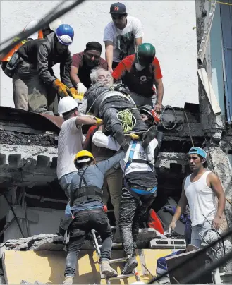  ?? Rebecca Blackwell ?? The Associated Press An injured man is pulled out of a building that collapsed Tuesday during an earthquake in Mexico City. Mayor Miguel Angel Mancera said buildings fell at 44 places in the capital alone.