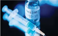  ?? — AFP file photo ?? This file shows a syringe and a bottle reading ‘Vaccine Covid-19’.