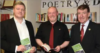  ??  ?? Author Peter Keating (centre) pictured with his brother John and Cllr. Ian Doyle at the launch of his book ‘The Green of Spring’ at Charlevill­e Library.