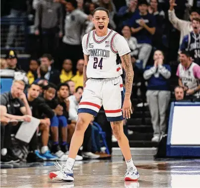  ?? Jessica Hill/Associated Press ?? UConn’s Jordan Hawkins reacts after making a 3-point basket in the second half against Seton Hall on Feb. 18 in Storrs.