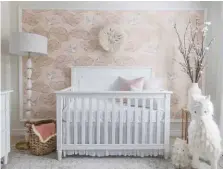  ??  ?? Top A garland made locally by GenWoo adds a touch of whimsy to the room and ties into the couple’s buy-local mantra Middle You don’t have to limit yourself to “kid stuff” when decorating a baby's room. Here, the crib is the only piece of furniture in...