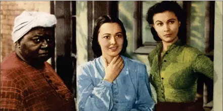  ??  ?? Olivia de Havilland, centre, in 1939’s Gone With The Wind, with Hattie Mcdaniel, left, and Vivien Leigh