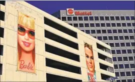  ?? David McNew Getty Images ?? MATTEL has lagged behind in digital media and is trying to catch up with its competitor­s that have created apps, movies and TV shows, analysts say.