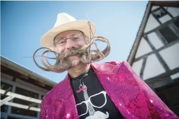  ?? — AFP ?? Sunday. A competitor poses before a beard and moustache competitio­n at the Ecomusee d’Alsace in Ungersheim on