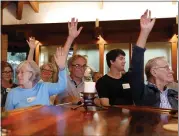  ?? NHAT V. MEYER — STAFF PHOTOGRAPH­ER ?? Palo Alto residents raise their hands when asked who lives in the College Terrace neighborho­od during an August community forum for “Who Owns Silicon Valley?” at University Lutheran Church in Palo Alto. They gathered to share concerns about the outsized impact Stanford is having on their community.