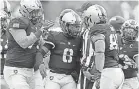  ?? DANNY WILD/USA TODAY ?? Quarterbac­k Kelvin Hopkins Jr. (8) and teammates celebrate during one of Army’s 11 wins.