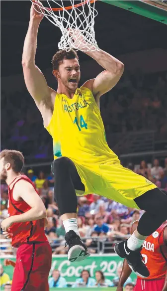  ?? Picture: GETTY IMAGES ?? Angus Brandt helps the Boomers to medal glory (below).