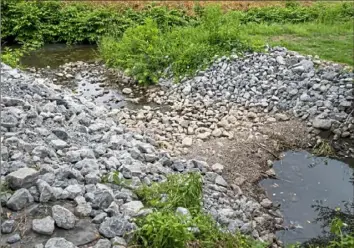  ?? Benjamin B. Braun/Post-Gazette ?? A stream that was cleaned after the February derailment in East Palestine.