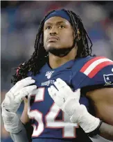  ?? ELISE AMENDOLA/AP ?? Patriots linebacker Dont’a Hightower watches from the sideline during the second half of a game against the Giants on Oct. 10, 2019, in Foxborough, Massachuse­tts. Hightower, who did not play last season, announced his retirement Tuesday in an essay posted in the Players’ Tribune.