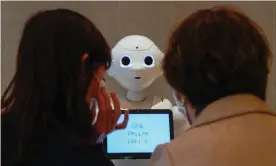  ??  ?? Pepper, a robot developed by SoftBank Robotics, welcomes customers in Tokyo, Japan, on 5 November. In the US, 11 million people were unemployed in October. Photograph: Kimimasa Mayama/EPA