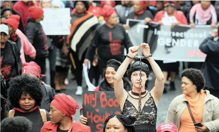  ?? PICTURE: AYANDA NDAMANE/ AFRICAN NEWS AGENCY (ANA) ?? BREAKING FREE: Shaking her chains is Carin Bester, part of the Cape Town Total Shutdown march against woman abuse and gender violence. The Total Shutdown campaign says South African women have little to celebrate.