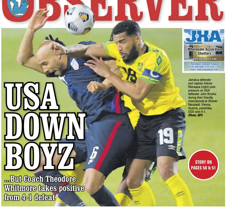  ?? (Photo: AFP) ?? Jamaica defender and captain Adrian Mariappa (right) puts pressure on USA defender John Brooks during their friendly internatio­nal at Wiener Neustadt, Vienna, Austria, yesterday. USA won 4-1.