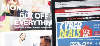  ?? JUSTIN SULLIVAN / GETTY IMAGES ?? A Cyber Monday ad for JC Penney is seen on laptops Monday. The online holiday-shopping day is likely to be the biggest ever; early numbers showed a 17 percent increase over last year.