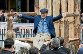  ??  ?? Spielberg had time to clown around with the giant’s big chair at The BFG’s British premiere.