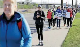  ?? [PHOTOS BY MIKE SIMONS, TULSA WORLD] ?? Tulsa Public Schools Superinten­dent Deborah Gist, second from left, and other educators walk from Tulsa to the Oklahoma State Capitol to protest lack of education funding.