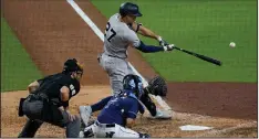  ?? (AP/Gregory Bull) ?? New York Yankees designated hitter Giancarlo Stanton connects for a grand slam in a 9-3 victory over the Tampa Bay Rays in the opener of an American League division series Monday in San Diego.